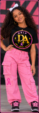 Youth model wearing a black Drip Avenue DA awareness shirt, pink cargo pants, and black-and-pink sneakers